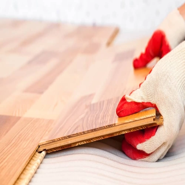 Hand installing click-lock laminate flooring