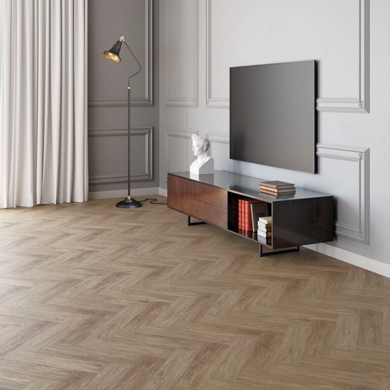 Light herringbone laminate flooring with soft wood grain and matte finish.