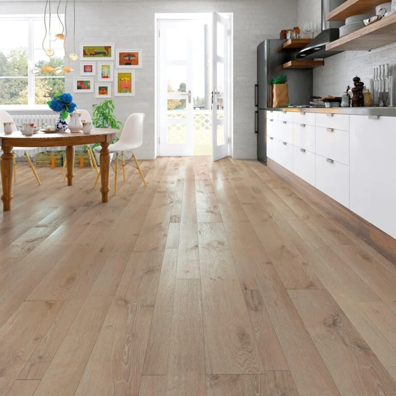 Light wood-look laminate flooring in wide plank format with natural grain