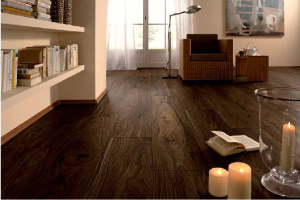 Warm living room with dark wood flooring and candles